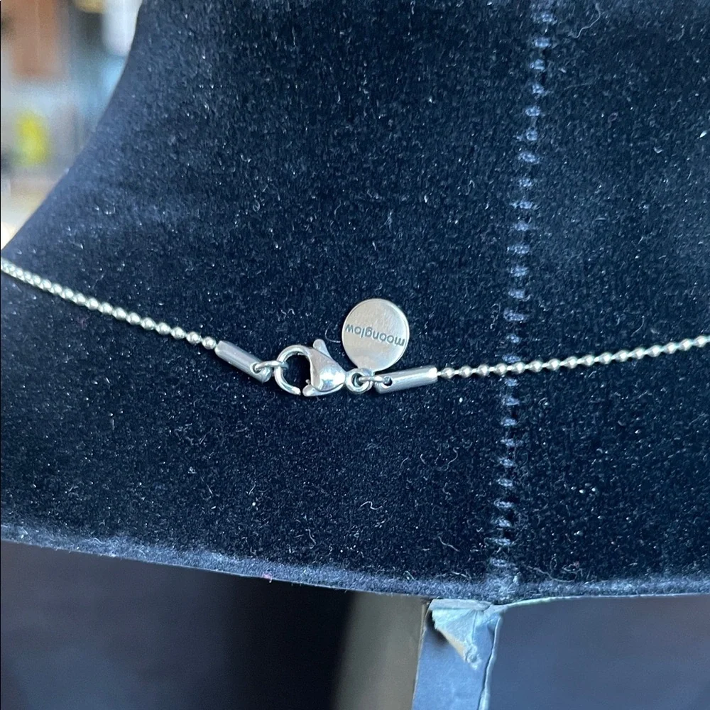 Round Silver Locket Necklace with Iridescent Blue-Green Orbs